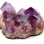 An amethyst specimen on a white background