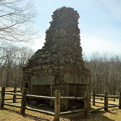 The ruins of the Lyon Homestead central chimney in Natchaug State Forest in Eastford Connecticut